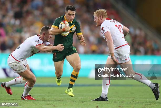 Cooper Cronk of Australia makes a break during the 2017 Rugby League World Cup Final between the Australian Kangaroos and England at Suncorp Stadium...