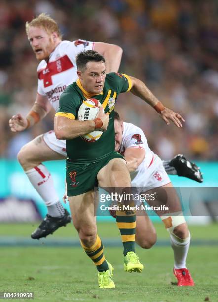Cooper Cronk of Australia makes a break during the 2017 Rugby League World Cup Final between the Australian Kangaroos and England at Suncorp Stadium...