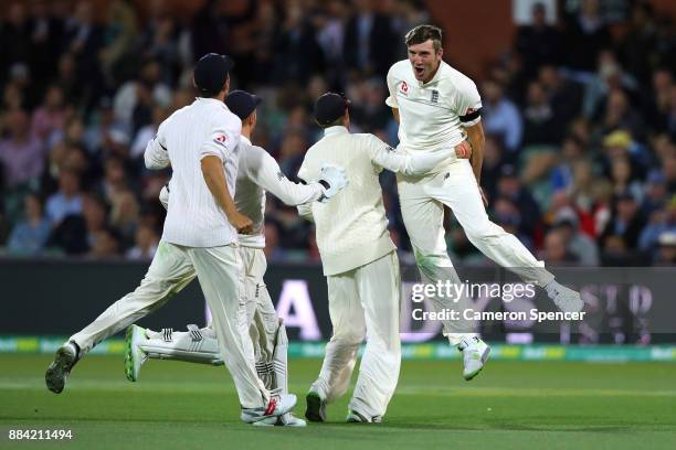 Craig Overton of England celebrates dismissing Steve Smith of Australia during day one of the Second Test match during the 2017/18 Ashes Series...