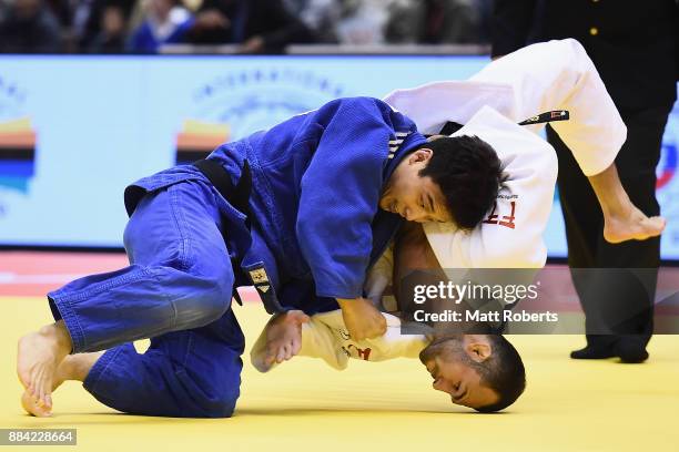 Baul An of South Korea competes against Baruch Shmailov of Israel in the Men's 66kg Bronze Final during day one of the Judo Grand Slam Tokyo at Tokyo...