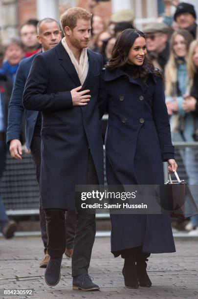 Prince Harry and Meghan Markle go on a walk about at Nottingham Contemporary on December 1, 2017 in Nottingham, England. Prince Harry and Meghan...