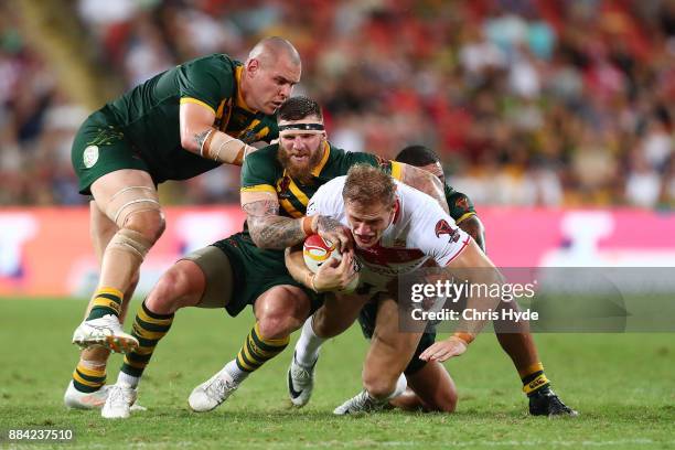 Thomas Burgess of England is tackled during the 2017 Rugby League World Cup Final between the Australian Kangaroos and England at Suncorp Stadium on...