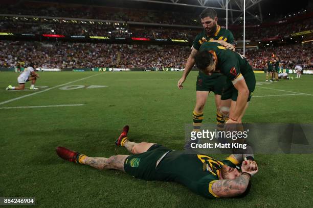 Josh Dugan, Billy Slater and Matt Gillett of the Kangaroos celebrate winning the 2017 Rugby League World Cup Final between the Australian Kangaroos...