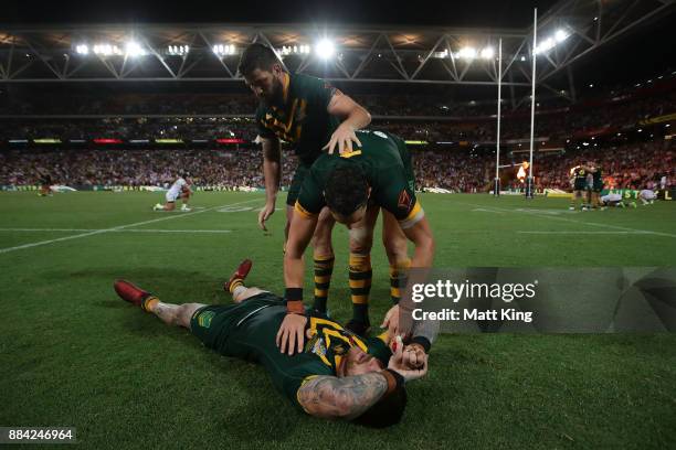 Josh Dugan, Billy Slater and Matt Gillett of the Kangaroos celebrate winning the 2017 Rugby League World Cup Final between the Australian Kangaroos...