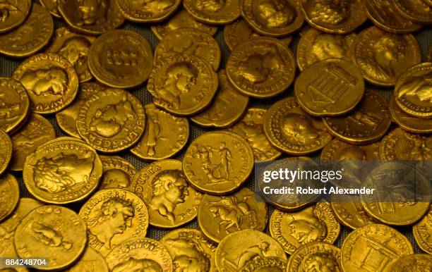Hoard of Roman coins from AD 160 on display at the British Museum in London, England. The gold aureus coins were found in 1911 during an excavation...