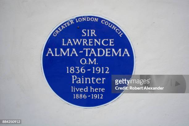 Greater London Council historical marker embedded in the wall in front of a London house indicates that painter Sir Lawrence Alma-Tadema once lived...