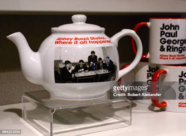 Souvenir teapots and mugs are among the Beatles-related items for sale at Abbey Road Shop, located near Abbey Road Studios in London, England,...