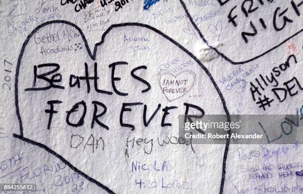 Graffiti-covered wall near Abbey Road Studios in London, England, formerly known as EMI Studios. The recording studio was established in 1931 by the...