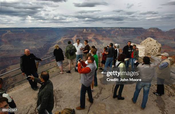 Tourists snap photos at Mather Point June 10, 2009 in the Grand Canyon National Park, Arizona. Work began this week with federal stimulus money to...