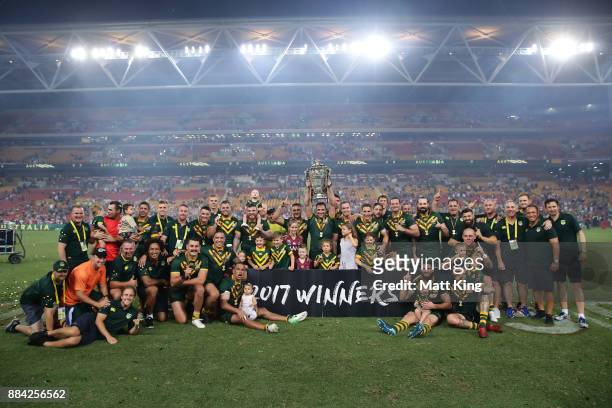 The Kangaroos celebrate with the trophy after winning the 2017 Rugby League World Cup Final between the Australian Kangaroos and England at Suncorp...