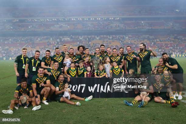 The Kangaroos celebrate with the trophy after winning the 2017 Rugby League World Cup Final between the Australian Kangaroos and England at Suncorp...