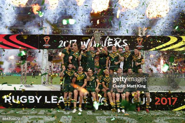 The Kangaroos celebrate with the trophy after winning the 2017 Rugby League World Cup Final between the Australian Kangaroos and England at Suncorp...