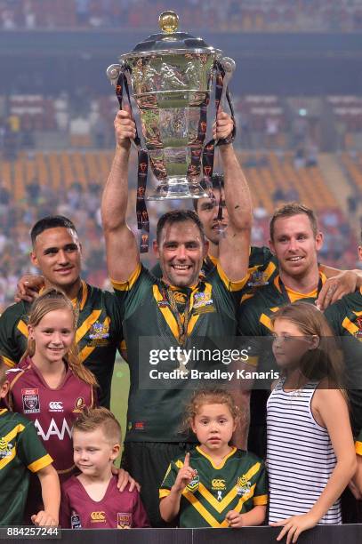 Cameron Smith of the Kangaroos holds aloft the trophy after winning the 2017 Rugby League World Cup Final between the Australian Kangaroos and...