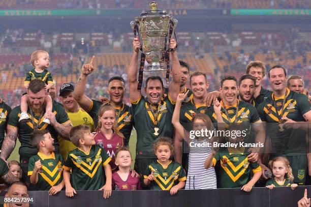 Cameron Smith of the Kangaroos holds aloft the trophy after winning the 2017 Rugby League World Cup Final between the Australian Kangaroos and...