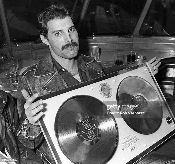 Photo of QUEEN; Collecting gold discs for Greatest Hits - Freddie Mercury