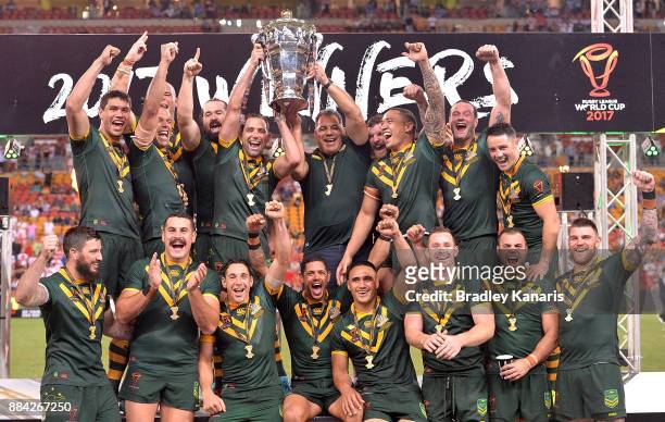 The Australian Kangaroos celebrate victory as captain Cameron Smith holds up the world cup trophy after the 2017 Rugby League World Cup Final between...
