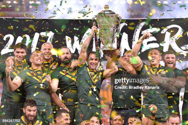 The Australian Kangaroos celebrate victory as captain Cameron Smith holds up the world cup trophy after the 2017 Rugby League World Cup Final between...