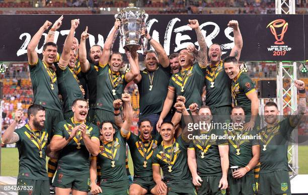 The Australian Kangaroos celebrate victory as captain Cameron Smith holds up the world cup trophy after the 2017 Rugby League World Cup Final between...