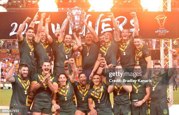 The Australian Kangaroos celebrate victory as captain Cameron Smith holds up the world cup trophy after the 2017 Rugby League World Cup Final between...