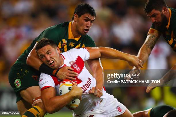 Sam Burgess of England is tackled by Jordan McLean of Australia during the rugby league World Cup men's final match between Australia and England in...