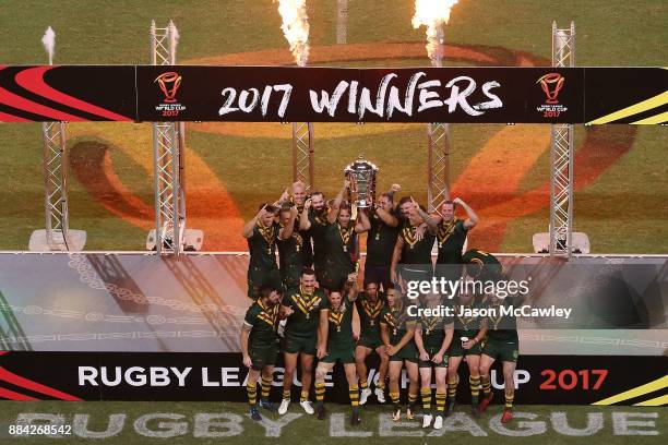 The Kangaroos celebrate with the trophy after winning the 2017 Rugby League World Cup Final between the Australian Kangaroos and England at Suncorp...