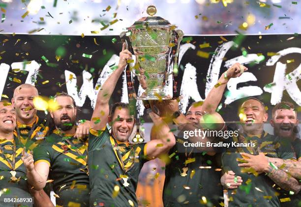 The Australian Kangaroos celebrate victory as captain Cameron Smith holds up the world cup trophy after the 2017 Rugby League World Cup Final between...