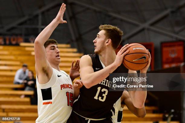 James Karnik of the Lehigh Mountain Hawks looks to pass against Ryan Schwieger of the Princeton Tigers during the second half at L. Stockwell Jadwin...