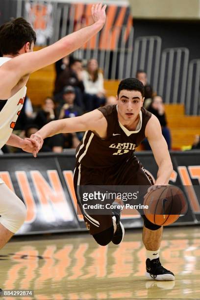 Jordan Cohen of the Lehigh Mountain Hawks drives against Sebastian Much of the Princeton Tigers during the second half at L. Stockwell Jadwin...