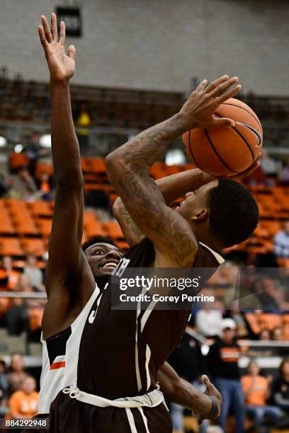 Lance Tejada of the Lehigh Mountain Hawks drives to the basket against Myles Stephens of the Princeton Tigers during the second half at L. Stockwell...