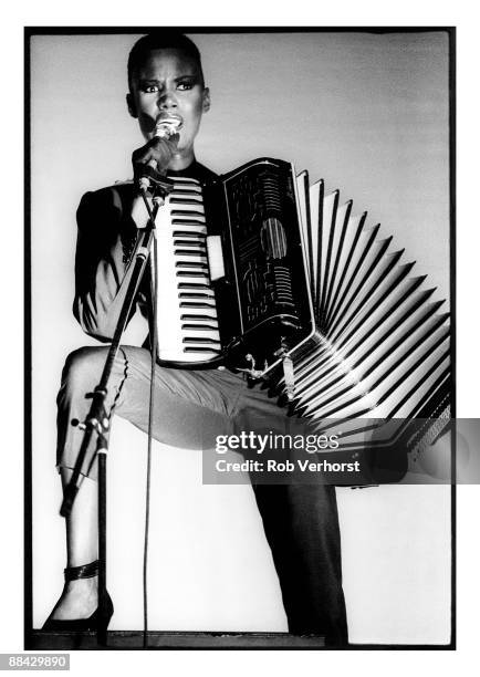 Photo of Grace JONES, Grace Jones performing on stage, accordion