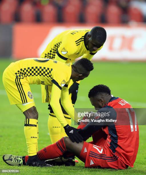 Columbus Crew SC players show their concern as Jozy Altidore of Toronto FC injures his ankle during the MLS Eastern Conference Finals, Leg 2 game at...
