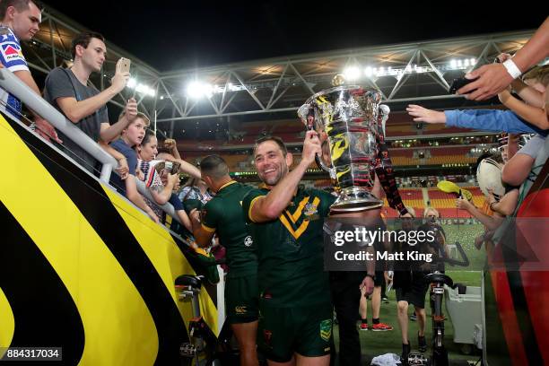 Cameron Smith of the Kangaroos holds aloft the Rugby League World Cup Trophy after winning the 2017 Rugby League World Cup Final between the...