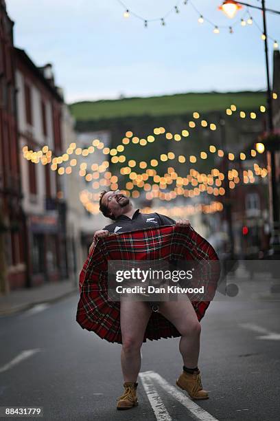 Motorbike fan flashes his kilt while out drinking with friends on June 6, 2009 in Douglas, Isle of Man. The annual TT race is one of the highlights...