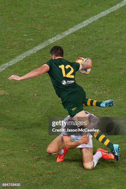 Matt Gillett of Australia is tackled during the 2017 Rugby League World Cup Final between the Australian Kangaroos and England at Suncorp Stadium on...