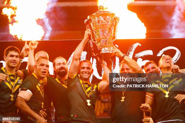 Australia celebrate their victory at the end of the rugby league World Cup men's final match between Australia and England in Brisbane on December 2,...