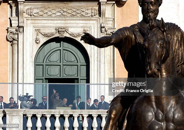 Lybia's Leader Muammar Gaddafi waves to the crowd as he arrives at the Capitole Square on June 11, 2009 in Rome, Italy. The Colonel visited Capitole...