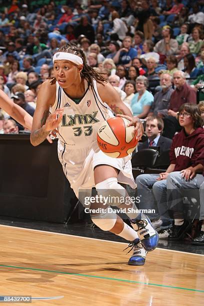 Seimone Augustus of the Minnesota Lynx moves the ball against the Chicago Sky during the game on June 6, 2009 at the Target Center in Minneapolis,...