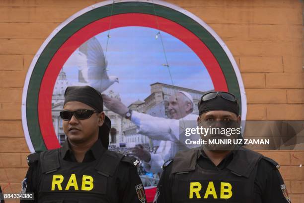 Members of Rapid Action Battalion secure the area ahead Pope Francis meeting with young people at Notre Dame College in Dhaka on December 2, 2017....