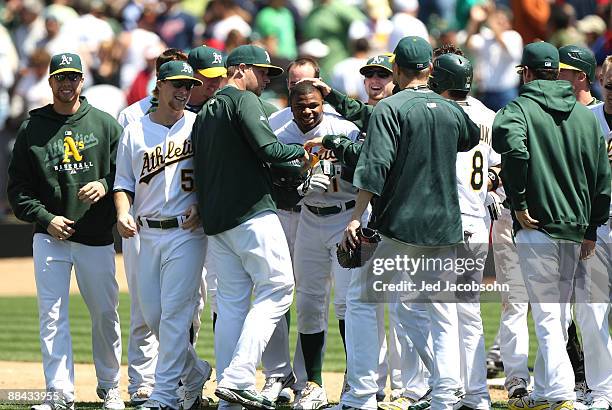 Rajai Davis of the Oakland Athletics celebrates after hitting the game winning single in the 9th inning against the Minnesota Twins during a Major...