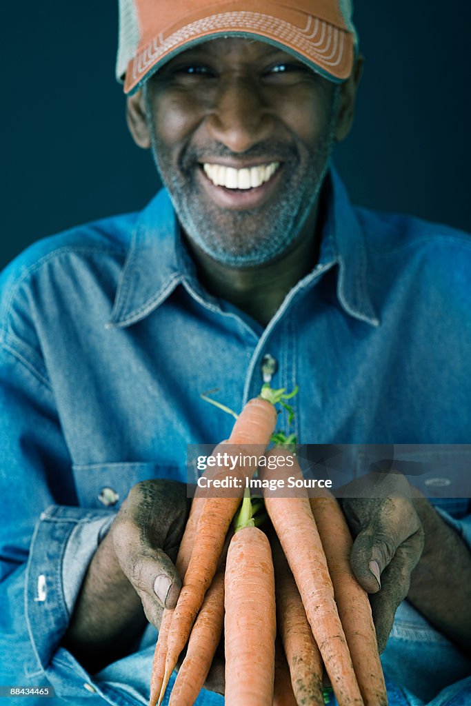 Man holding carrots