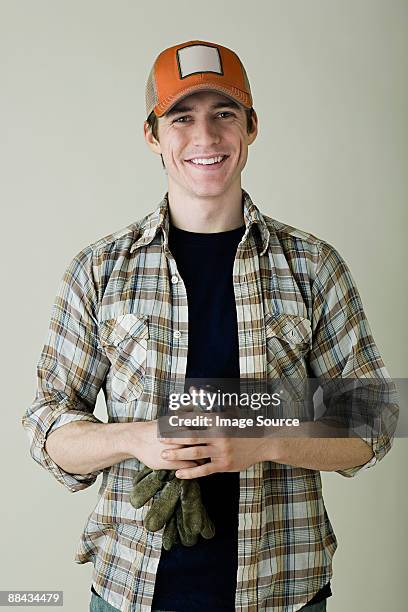 portrait of a farm worker - gorra de béisbol fotografías e imágenes de stock