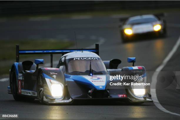 The Team Peugeot Total 908 HDi FAP of Stephane Sarrazin of France, Franck Montagny of France and Sebastien Bourdais of France drives during...