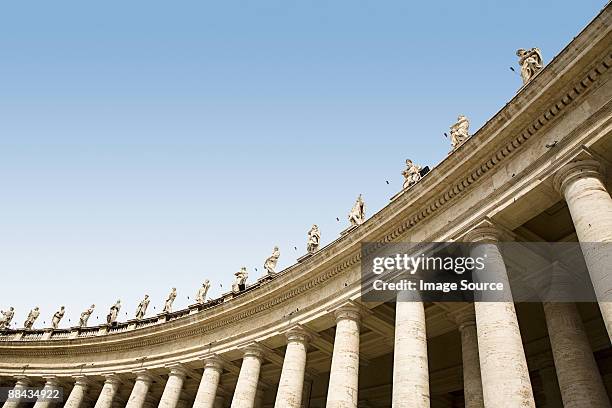 low angle view of statues in st peters square - st peter's square stock pictures, royalty-free photos & images