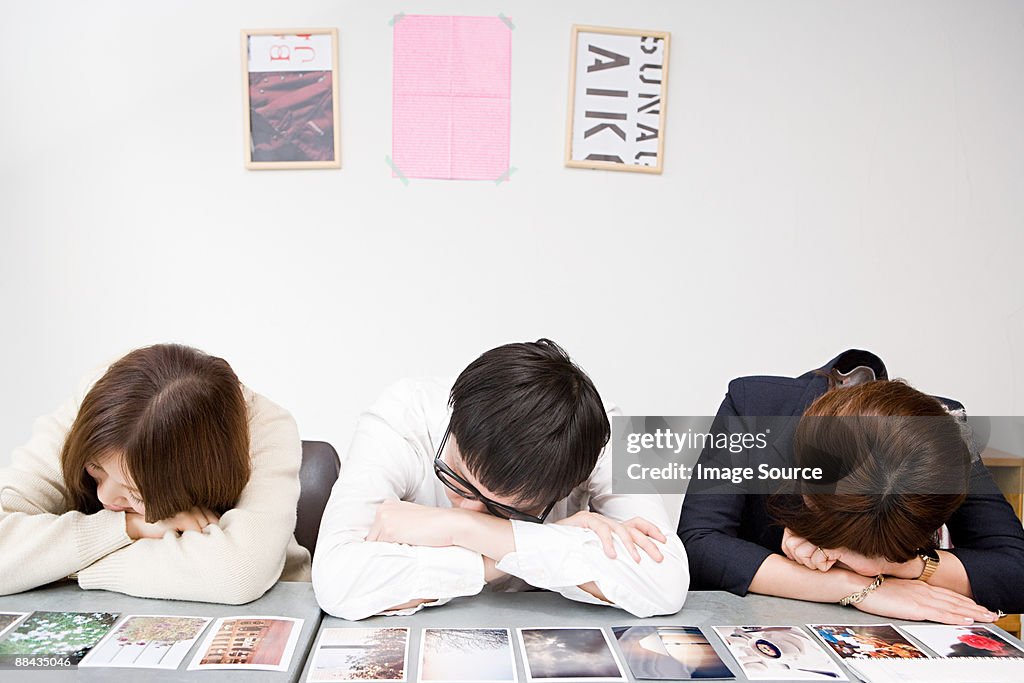 People sleeping by photographs