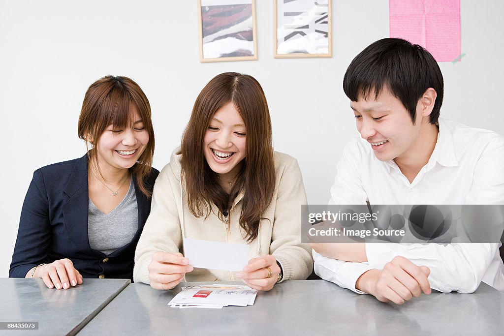 People looking at photographs