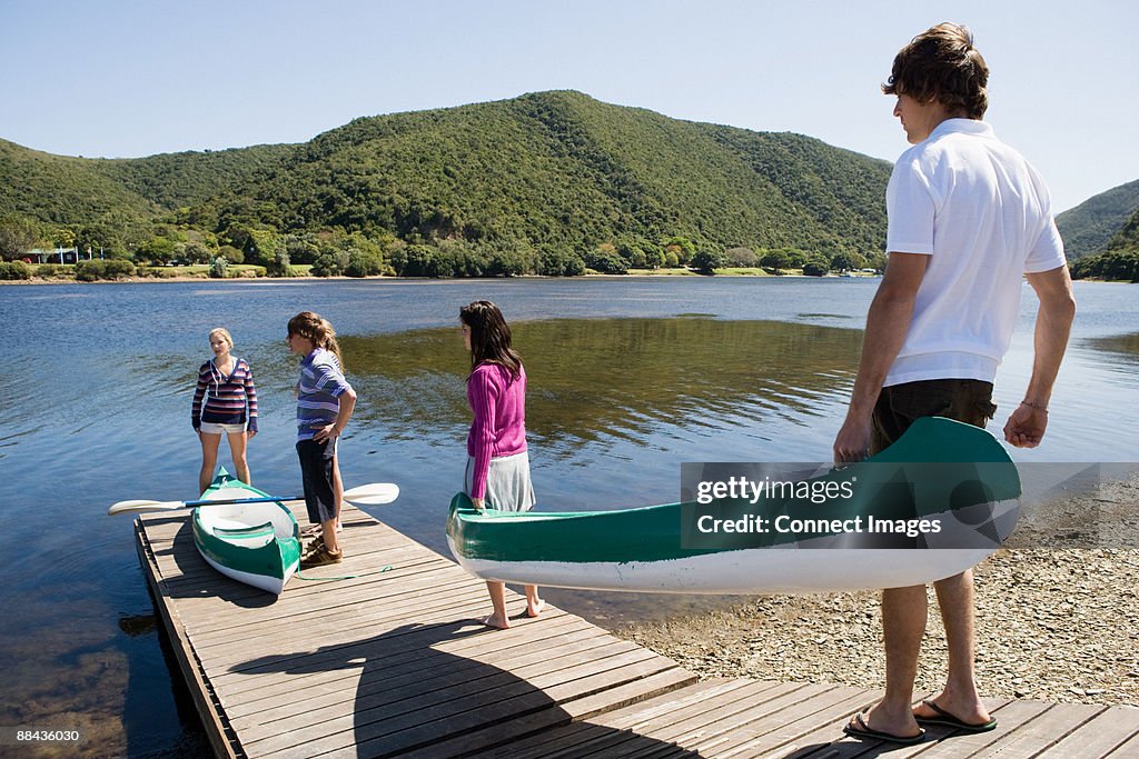 Teenagers with canoes