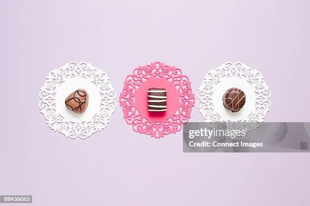 chocolates on doilies - doily stock pictures, royalty-free photos & images