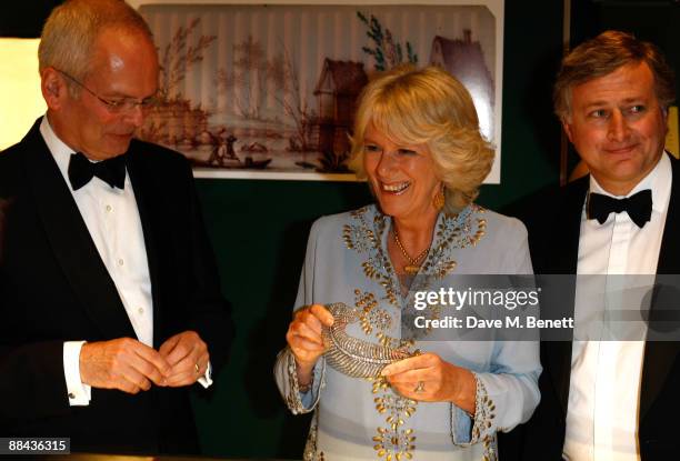 Geoffrey Munn, Camilla, Duchess of Cornwall and Simon Phillips attend the Grosvenor House Art & Antiques Fair Charity Gala in aid of the National...