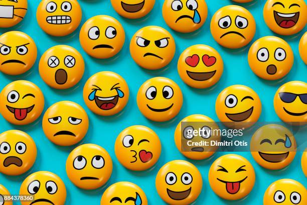 emoji badges on blue background - emotion stock pictures, royalty-free photos & images