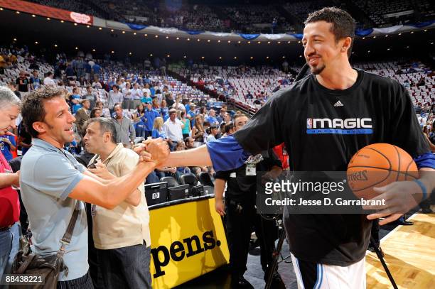 Italian Footballer Alessandro Del Piero greets Hedo Turkoglu of the Orlando Magic prior to the Magic playing against the Los Angeles Lakers in Game...